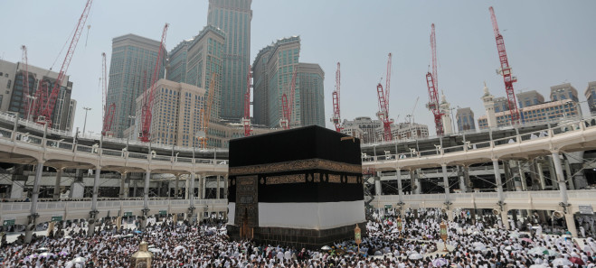 Muslim pilgrims circle the Kaaba, the cubic building at the Grand Mosque in the Muslim holy city of Mecca, Saudi Arabia, Tuesday, Sept. 22, 2015. In Mecca, the holy site all the worlds Muslims pray toward, the annual hajj pilgrimage began Tuesday with over 2 million faithful gathering to call out in Arabic: "Here I am, God, answering your call. Here I am." (AP Photo/Mosa'ab Elshamy)